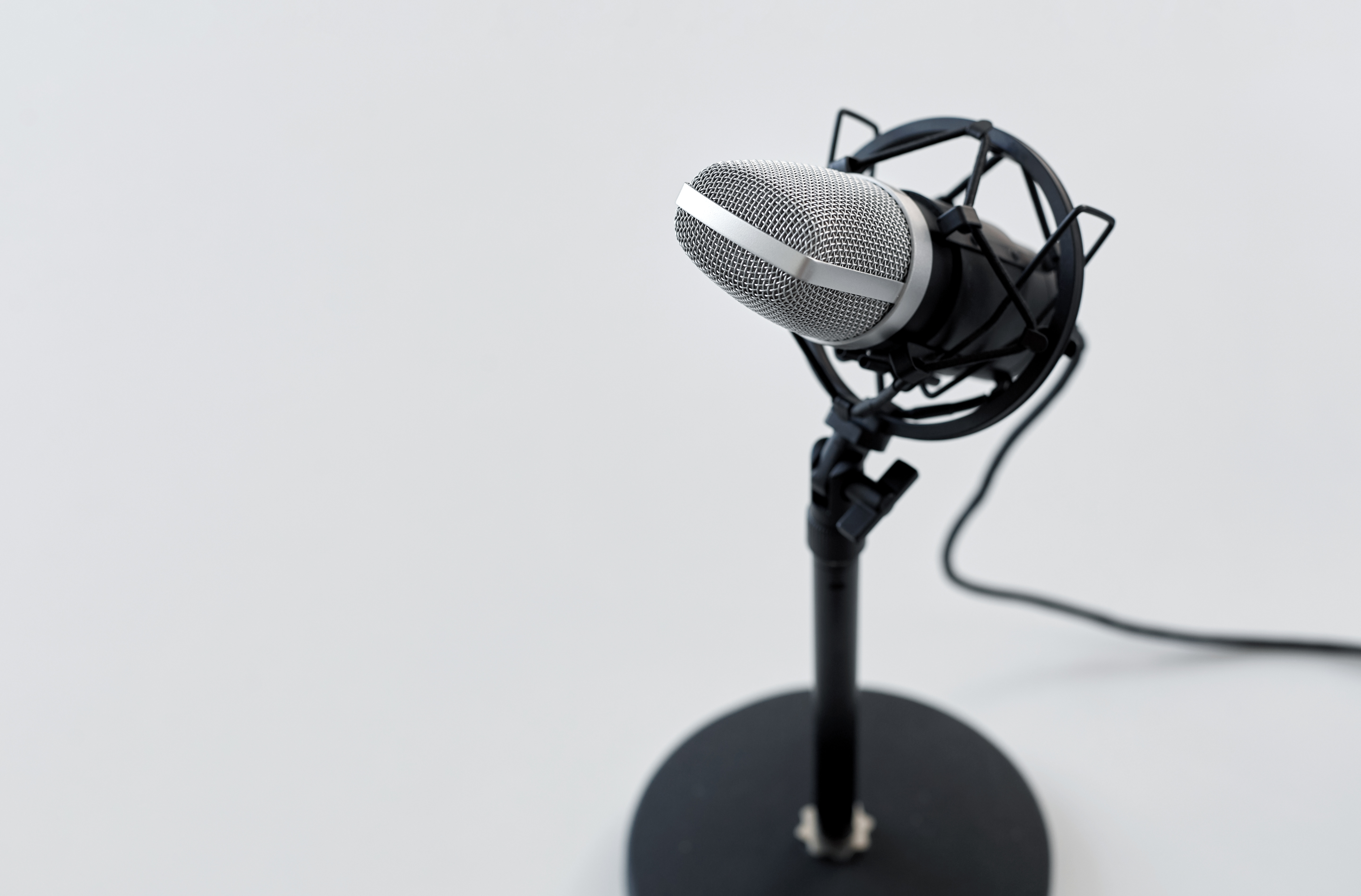 Close up of microphone on white background